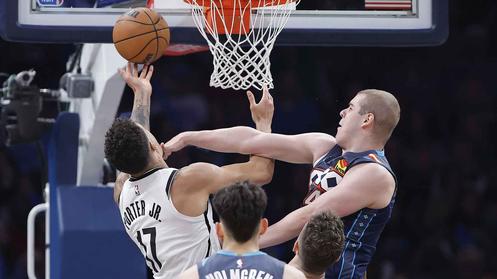 Thunder guard Nikola Topić (44) fouls Brooklyn Nets forward Michael Porter Jr. (17) during the second half at Paycom Center