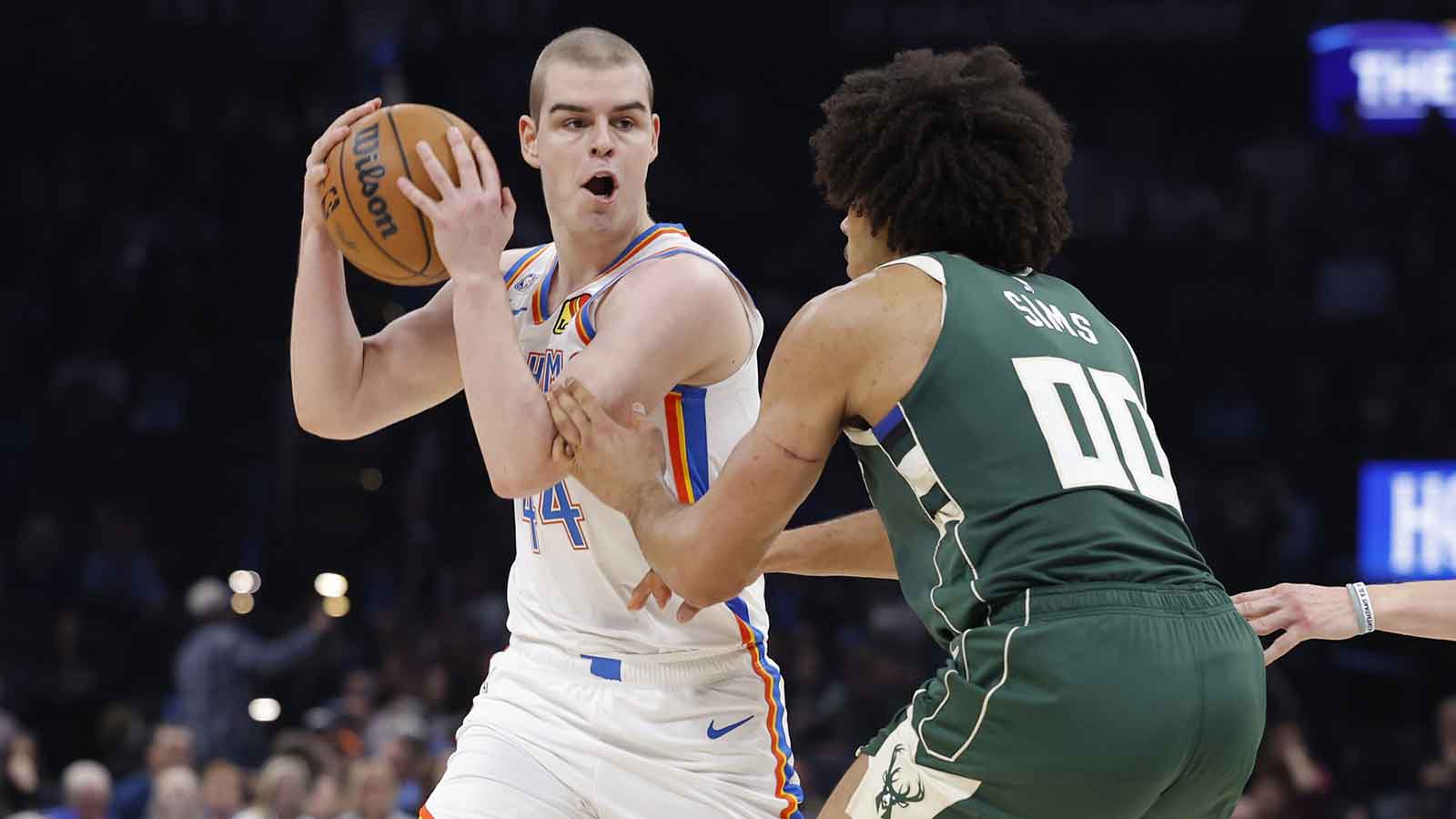 Thunder guard Nikola Topić (44) moves the ball against Milwaukee Bucks center Jericho Sims (00) during the second half at Paycom Center