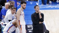 Thunder forward Chet Holmgren (7) and head coach Mark Daigneault during the fourth quarter against the Indiana Pacers in game five of the 2025 NBA Finals at Paycom Center with the NBA All-Star Saturday logo in the background
