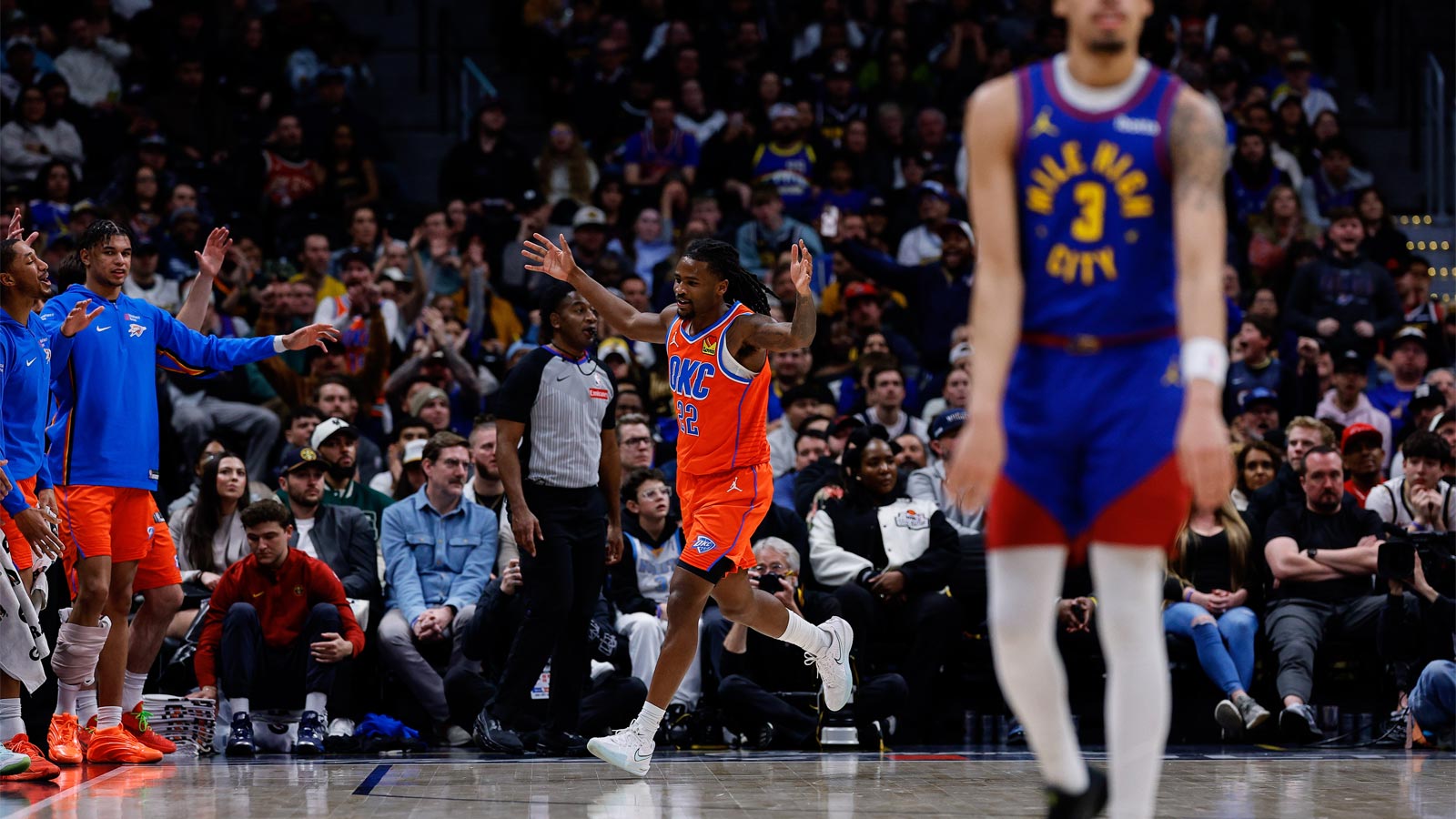 Thunder guard Cason Wallace (22) reacts after a play against the Denver Nuggets in the fourth quarter at Ball Arena