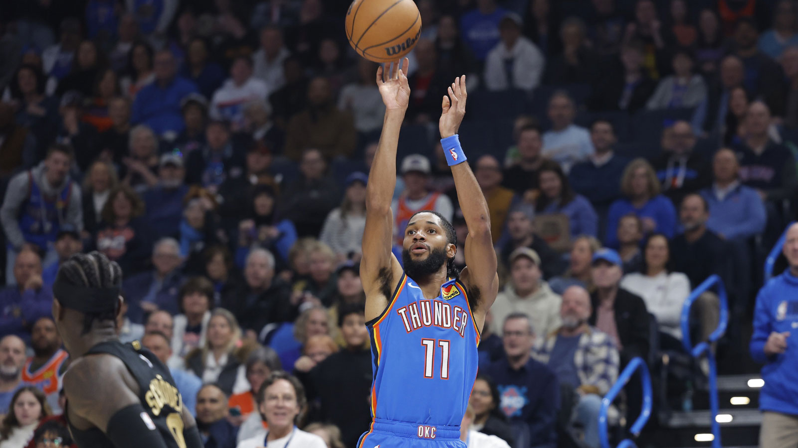 Thunder guard Isaiah Joe (11) shoots a three point basket against the Cleveland Cavaliers during the first half at Paycom Center