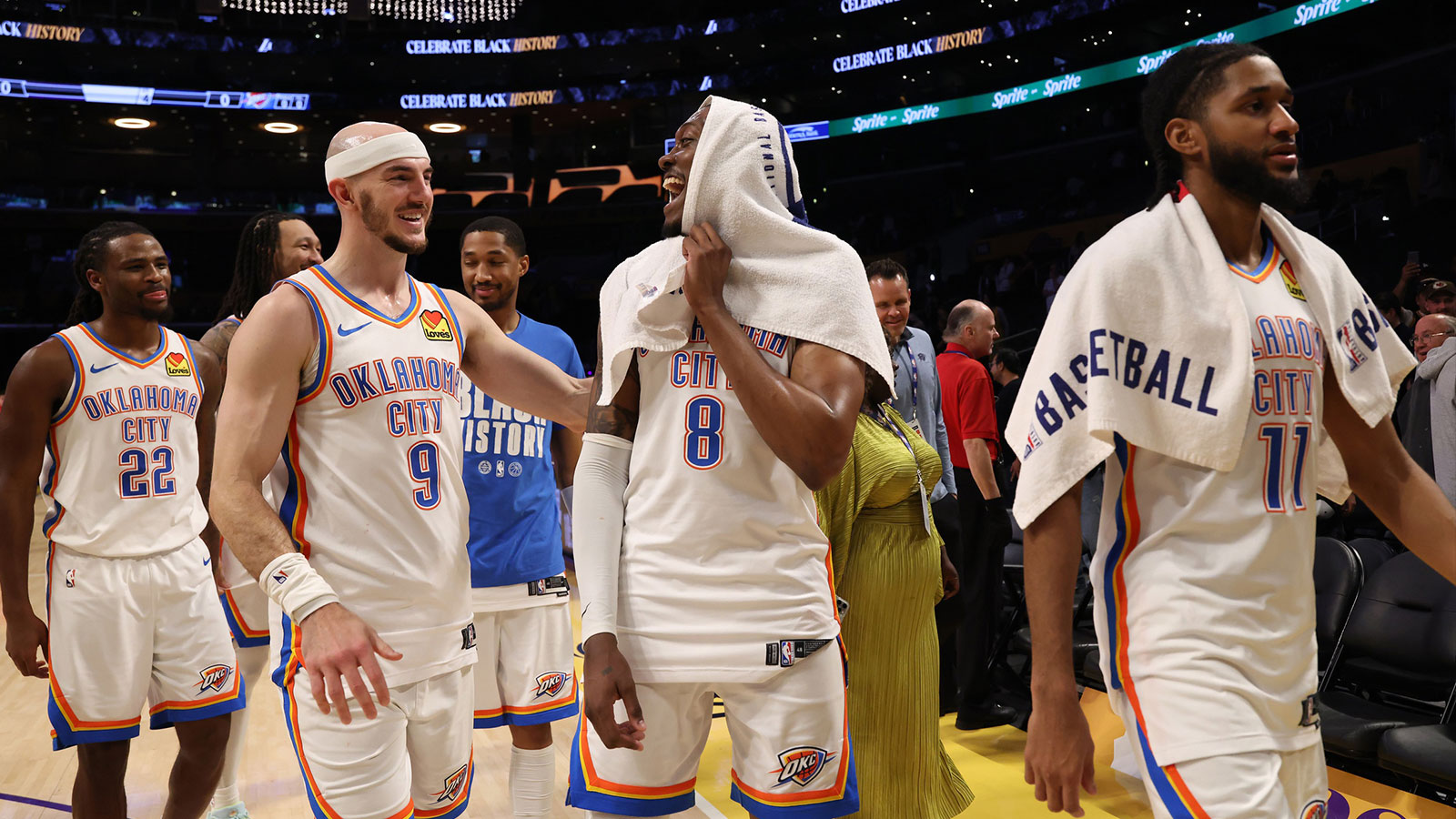 Thunder guard Jalen Williams (8) celebrates with guard Alex Caruso (9) after defeating the Los Angeles Lakers 119-110 at Crypto.com Arena