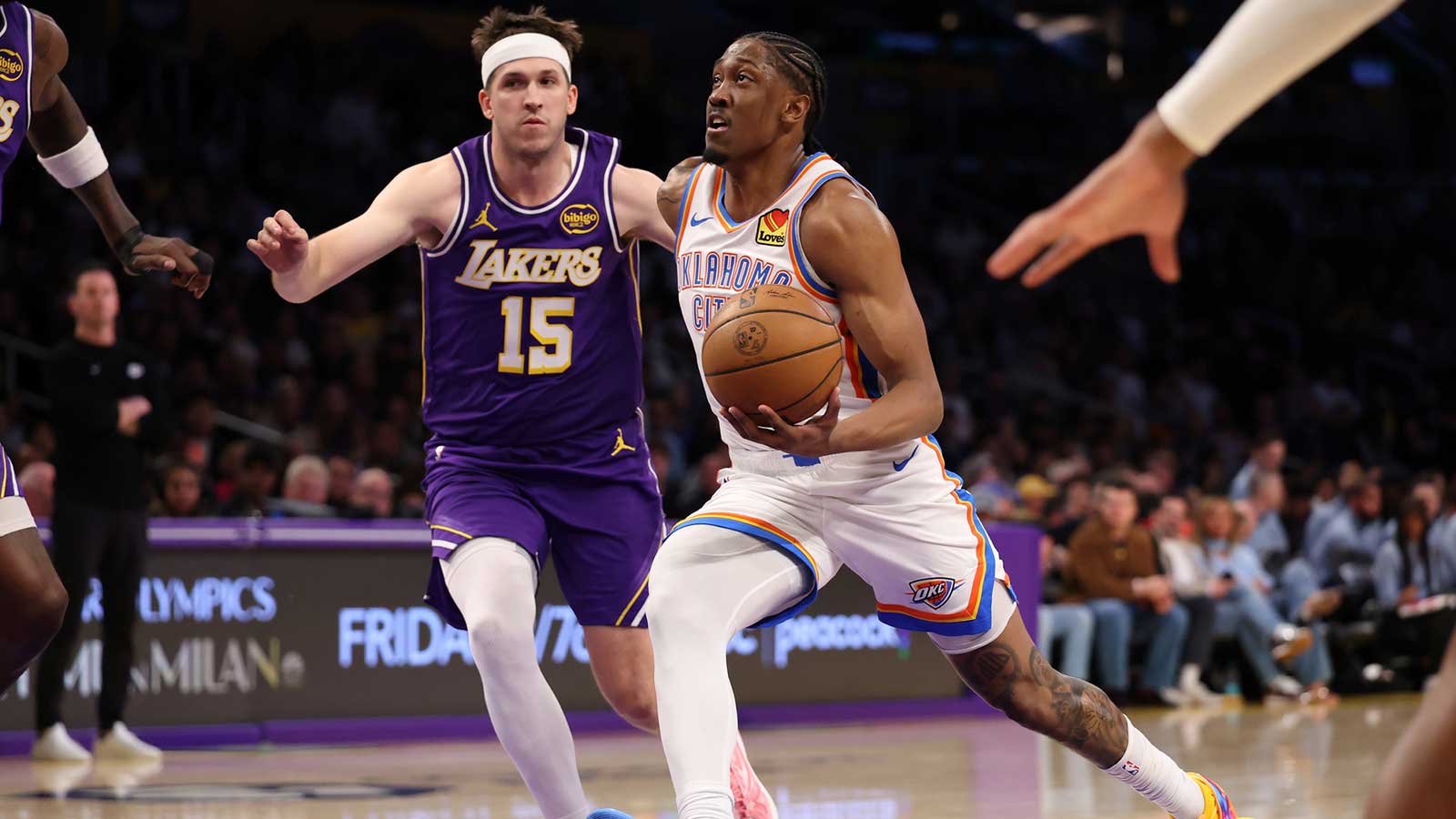 Thunder guard Jalen Williams (8) goes to the basket against Los Angeles Lakers guard Austin Reaves (15) during the first half at Crypto.com Arena