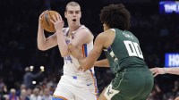 Thunder guard Nikola Topić (44) moves the ball against Milwaukee Bucks center Jericho Sims (00) during the second half at Paycom Center