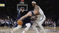 Thunder guard Nikola Topić (44) drives past Brooklyn Nets guard/forward Terance Mann (14) during the second half at Paycom Center