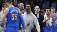 Thunder guard Shai Gilgeous-Alexander (2) screams as he watches his team play against the Cleveland Cavs during the second half at Paycom Center with Jalen Williams in the background