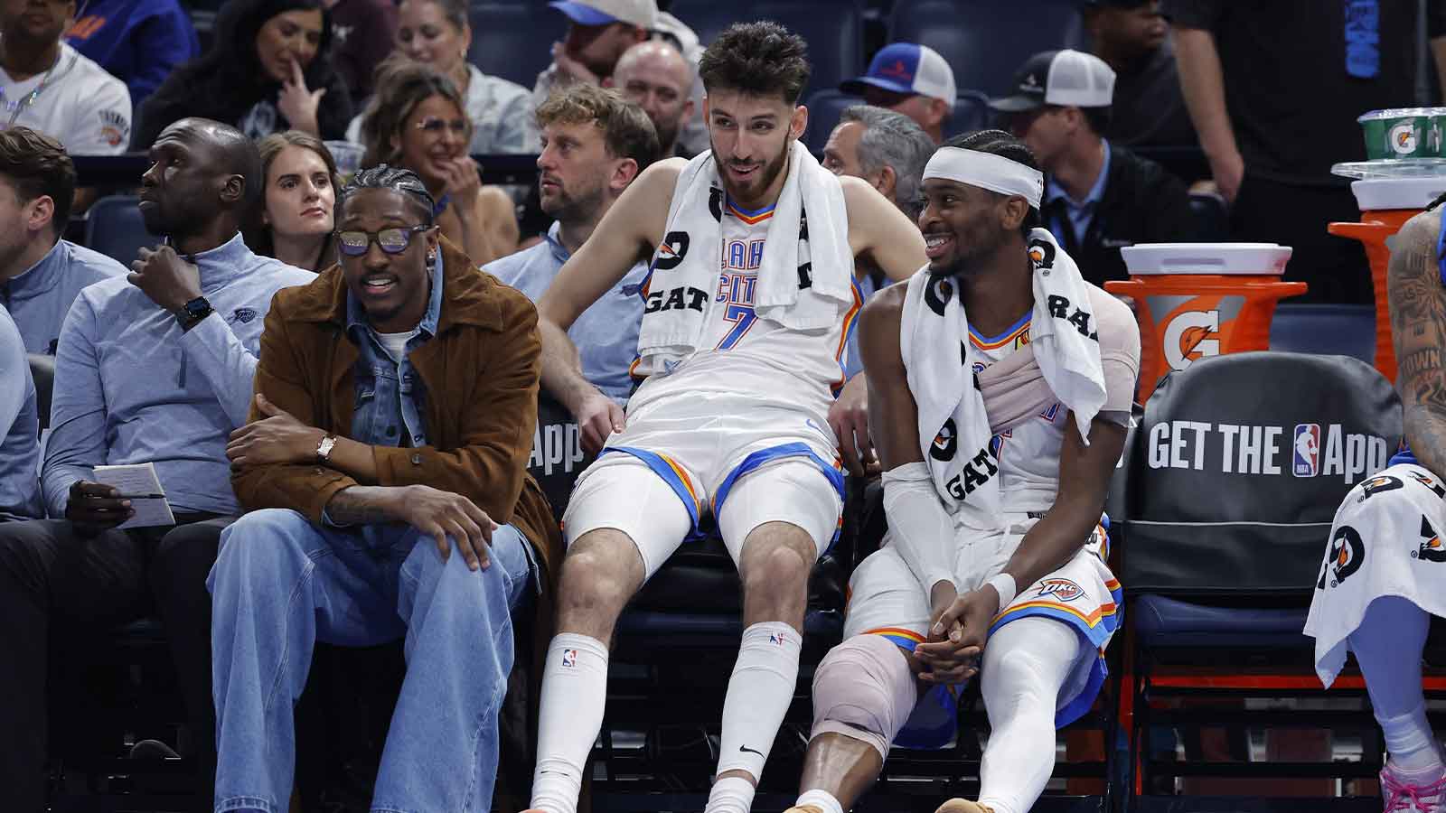 Thunder guard Jalen Williams (8), center Chet Holmgren (7), and guard Shai Gilgeous-Alexander (2) talk while sitting on the bench during the fourth quarter against the Los Angeles Lakers at Paycom Center