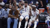 Thunder guard Jalen Williams (8), center Chet Holmgren (7), and guard Shai Gilgeous-Alexander (2) talk while sitting on the bench during the fourth quarter against the Los Angeles Lakers at Paycom Center