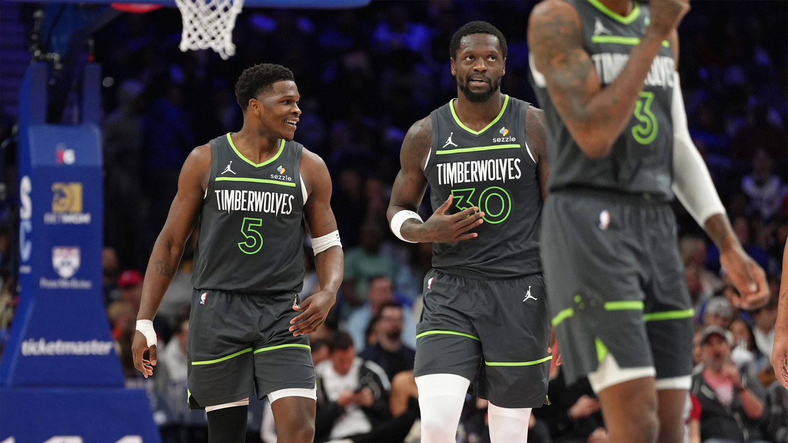 Timberwolves guard Anthony Edwards (5) celebrates with Minnesota Timberwolves forward Julius Randle (30) after scoring a first-half goal against the Golden State Warriors during Game 5 of the second round of the 2025 NBA playoffs at Target Center
