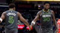 Timberwolves forward/center Julius Randle (30) claps hands with guard Anthony Edwards (5) after a play against the New Orleans Pelicans during the second half at Smoothie King Center. Is Julius Randle playing tonight vs. the Pelicans