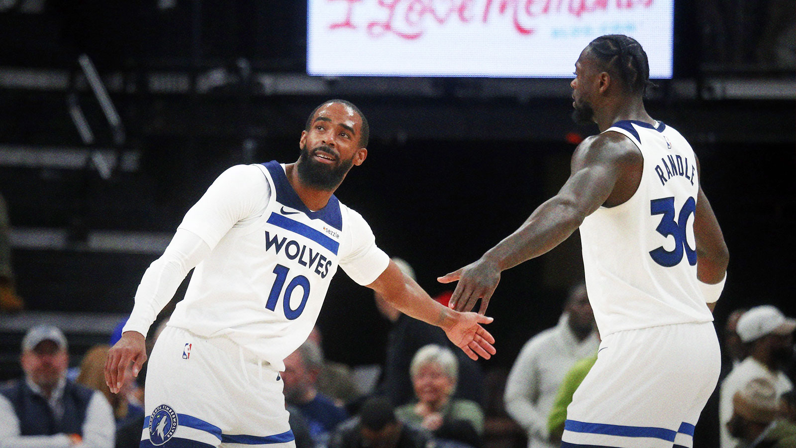 Timberwolves guard Mike Conley (10) reacts with forward Julius Randle (30)