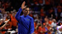 Florida Gators head coach Todd Golden gestures with a Gator Chomp against the Kentucky Wildcats during the second half at Exactech Arena at the Stephen C. O'Connell Center.