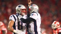 New England Patriots quarterback Tom Brady (12) celebrates a touchdown with tight end Rob Gronkowski (87) against the Kansas City Chiefs in the AFC Championship game at Arrowhead Stadium.