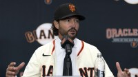 Tony Vitello answers questions from the media as he is introduced as the new manager of the San Francisco Giants at Oracle Park.