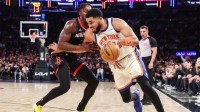 New York Knicks center Karl-Anthony Towns (32) looks to drive past Houston Rockets forward Dorian Finney-Smith (2) in the fourth quarter at Madison Square Garden.