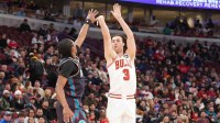 Feb 21, 2026; Chicago, Illinois, USA; Chicago Bulls guard Josh Giddey (3) shoots a three-point basket over Detroit Pistons guard Ausar Thompson (9) during the first half at United Center. Mandatory Credit: David Banks-Imagn Images