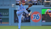 Philadelphia Phillies shortstop Trea Turner (7) throws to first for an out in the seventh inning against the Los Angeles Dodgers during game four of the NLDS round for the 2025 MLB playoffs at Dodger Stadium.