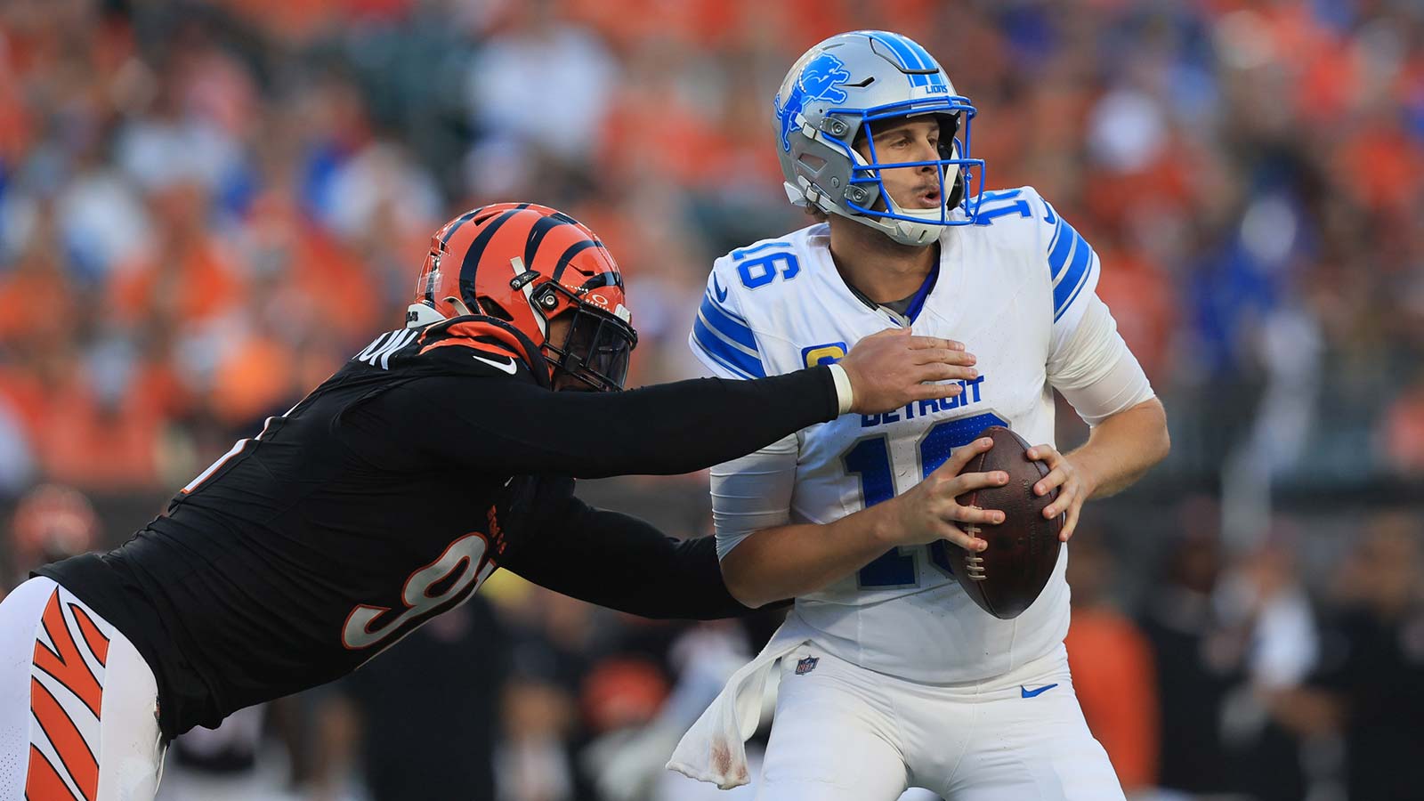 Detroit Lions quarterback Jared Goff (16) is tackled by Cincinnati Bengals defensive end Trey Hendrickson (91) during the fourth quarter at Paycor Stadium.