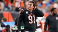 Cincinnati Bengals defensive end Trey Hendrickson (91) watches a replay as the Detroit Lions celebrate a touchdown in the fourth quarter of the NFL Week 5 game between the Cincinnati Bengals and the Detroit Lions at Paycor Stadium in downtown Cincinnati on Sunday, Oct. 5, 2025. The Bengals continued a losing streak, falling 37-24 to the Lions.