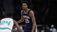New Orleans Pelicans forward Trey Murphy III (25) handles the ball against Charlotte Hornets forward Brandon Miller (24) during the first quarter at the Spectrum Center.