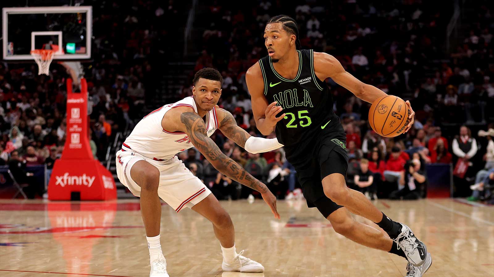 New Orleans Pelicans forward Trey Murphy III (25) drives against Houston Rockets forward Jabari Smith Jr. (10) during the third quarter at Toyota Center.