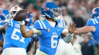 Mississippi Rebels quarterback Trinidad Chambliss (6) drops back to pass against the Miami Hurricanes in the first half during the 2026 Fiesta Bowl and semifinal game of the College Football Playoff at State Farm Stadium.