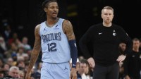 Memphis Grizzlies guard Ja Morant (12) and head coach Tuomas Iisalo looks on during the third quarter against the Atlanta Hawks at FedExForum.