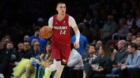 Miami Heat guard Tyler Herro (14) dribbles the basketball against the Phoenix Suns during the first quarter at Kaseya Center.