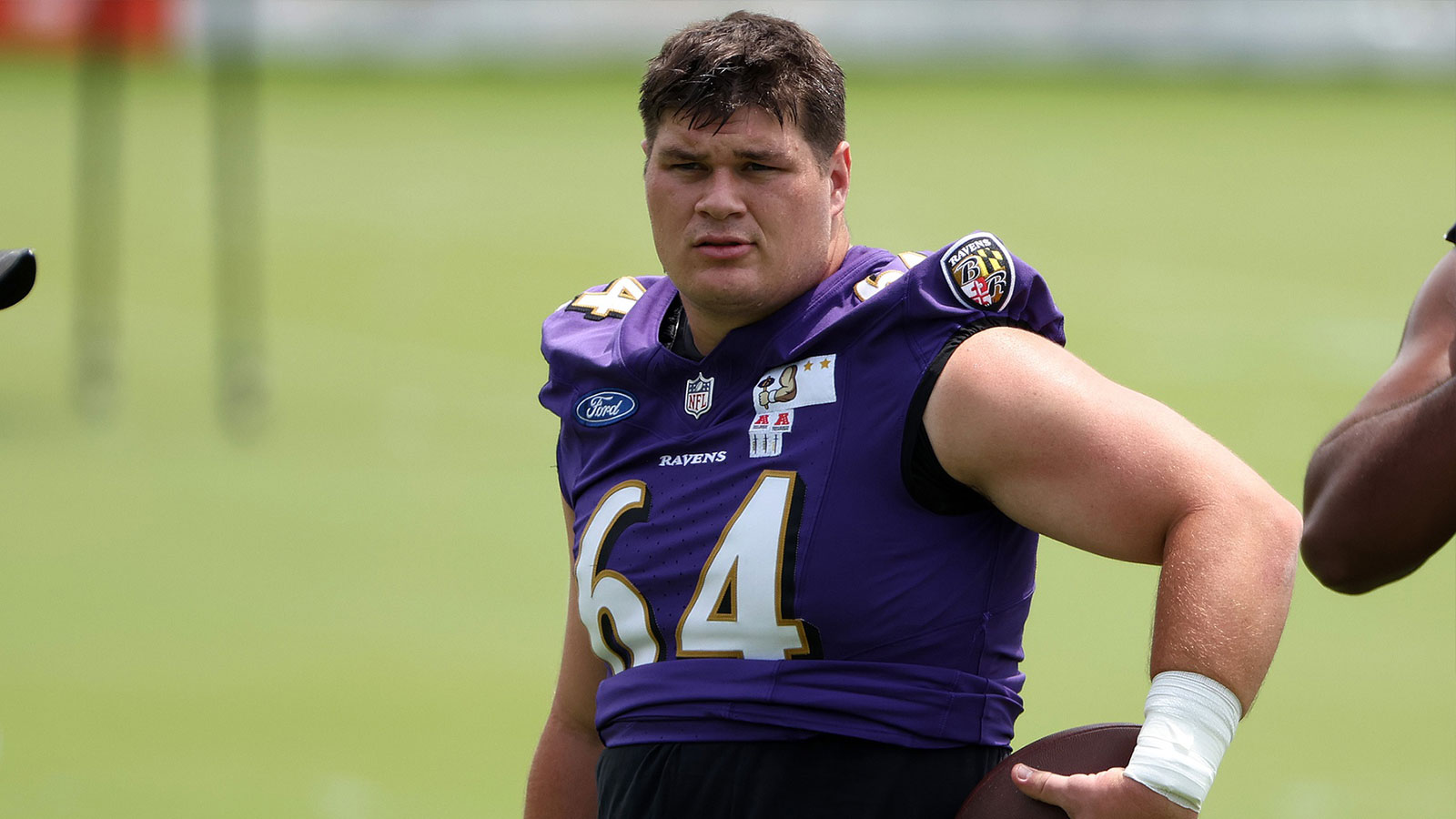  Baltimore Ravens center Tyler Linderbaum (64) looks on during an NFL OTA at Under Armour Performance Center. 