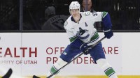 Vancouver Canucks defenseman Tyler Myers (57) looks for a play against the Utah Mammoth during the third period at Delta Center.