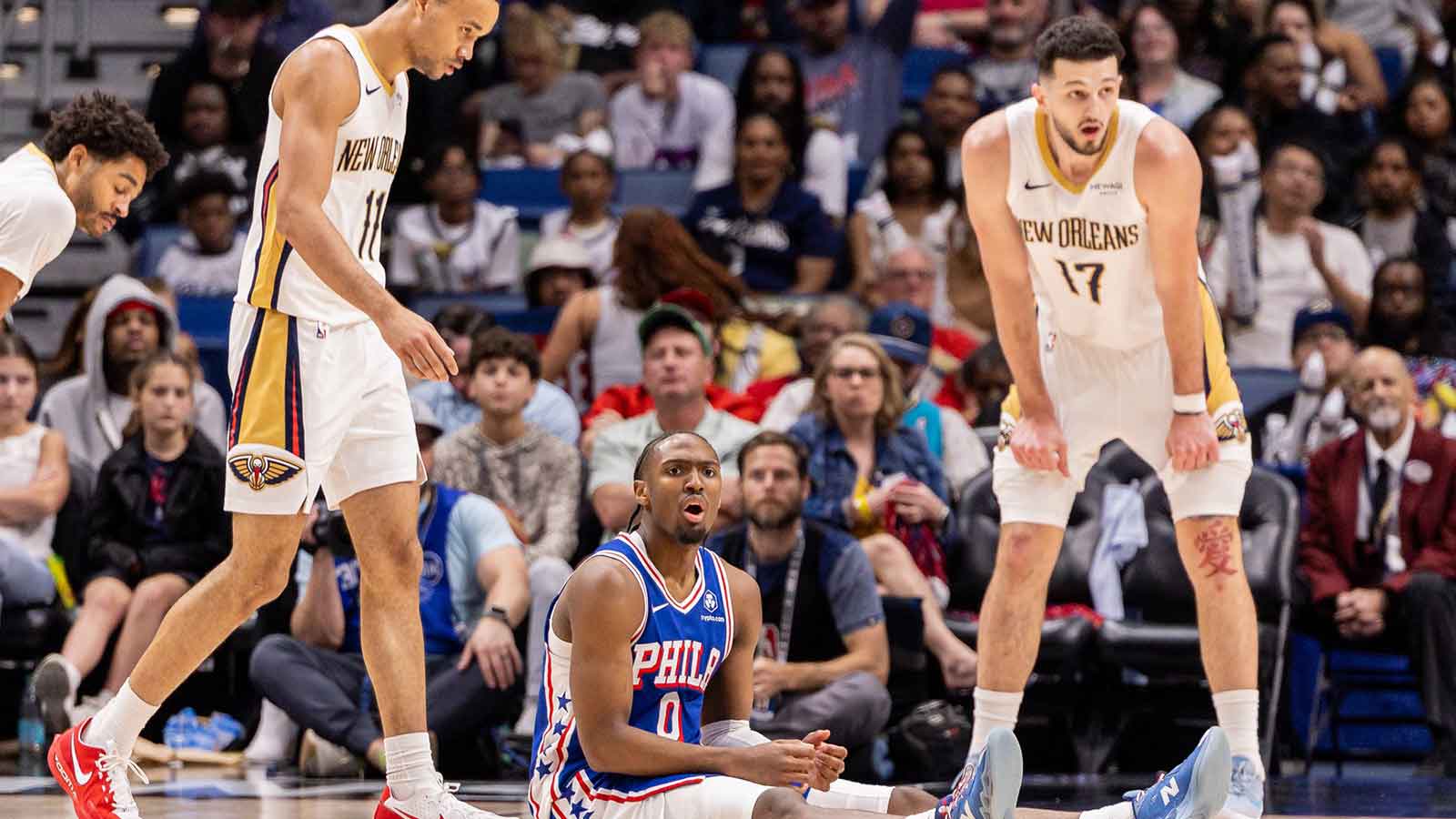 Philadelphia 76ers guard Tyrese Maxey (0) reacts to a play against New Orleans Pelicans forward/center Karlo Matković (17) and guard Bryce McGowens (11) during the second half at Smoothie King Center.