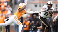 Vanderbilt tight end Eli Stowers (9) makes the catch under coverable by Tennessee defensive back Andre Turrentine (2) in an NCAA college football game in Nov. 29, 2025, in Knoxville, Tennessee.