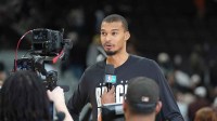 San Antonio Spurs forward Victor Wembanyama (1) gives an interview after the game against the Dallas Mavericks at Frost Bank Center.