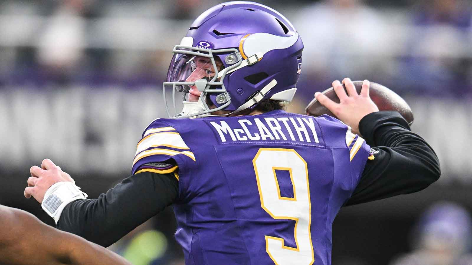 Minnesota Vikings quarterback J.J. McCarthy (9) throws a pass against the Green Bay Packers during the first quarter at U.S. Bank Stadium.