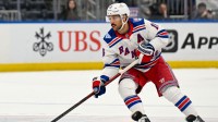 New York Rangers center Vincent Trocheck (16) skates with the puck against the New York Islanders during the third period at UBS Arena.
