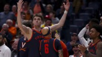 Virginia Cavaliers center Johann Gruenloh (17) cheers on the crowd against the Ohio State Buckeyes during the second half at Bridgestone Arena.