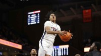 Virginia Cavaliers guard Elijah Gertrude (12) shoots the ball against the Miami (Fl) Hurricanes during the second half at John Paul Jones Arena.