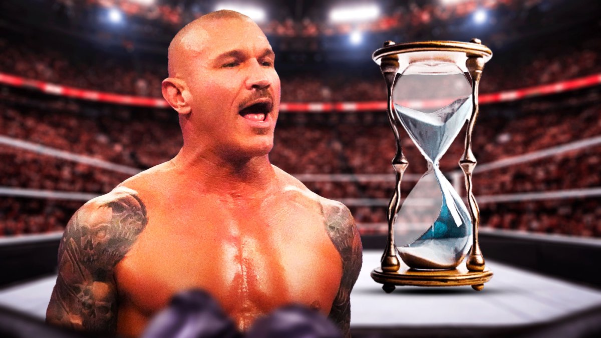 WWE Superstar Randy Orton, who discussed his eventual retirement, with an hourglass.