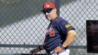 Atlanta Braves manager coach Walt Weiss (4) looks on during spring training workouts.
