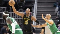Golden State Warriors center Al Horford (20) looks for an open teammate over Boston Celtics guard Derrick White (9) during the second quarter at Chase Center.