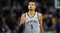 San Antonio Spurs forward Victor Wembanyama (1) celebrates a three-point basket against the Golden State Warriors in the fourth quarter at Chase Center.