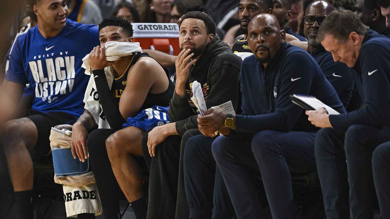 Golden State Warriors guard Stephen Curry (30) looks on from the bench during the second period against the Philadelphia 76ers at Chase Center.