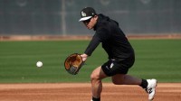 Chicago White Sox first baseman Munetaka Murakami (5) works out during spring training camp at Camelback Ranch.