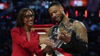 State Farm Chief Agency Sales and Marketing Officer Kristyn Cash presents the three point contest trophy to Portland Trail Blazers guard Damian Lillard (0) during the 2026 NBA All Star Saturday Night at Intuit Dome. Mandatory Credit: Kirby Lee-Imagn Images