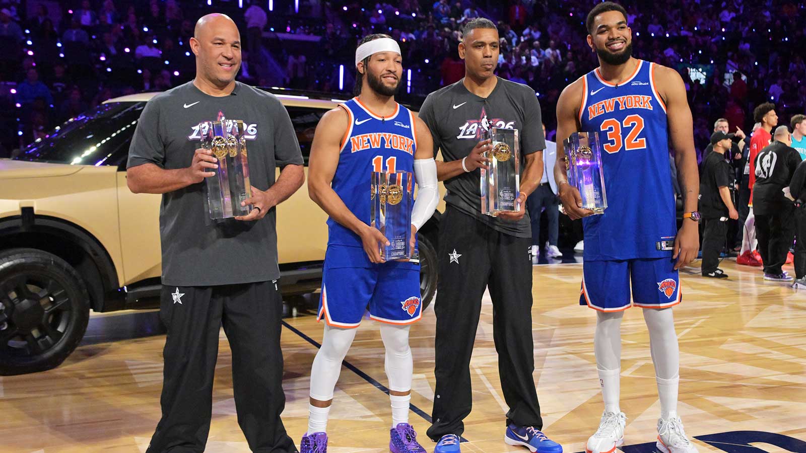 Feb 14, 2026; Los Angeles, CA, USA; Team Knicks guard Jalen Brunson (11) and center Karl-Anthony Towns (32) of the New York Knicks and NBA legend Allan Houston and passer Rick Brunson celebrate after winning the shooting stars competition during the 2026 NBA All Star Saturday Night at Intuit Dome. Mandatory Credit: Jayne Kamin-Oncea-Imagn Images