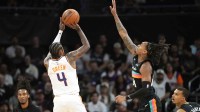 Phoenix Suns guard Jalen Green (4) shoots over San Antonio Spurs guard Devin Vassell (24) during the first half against the San Antonio Spurs at Moody Center.