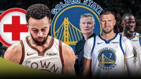 Stephen Curry injured with Steve Kerr, Draymond Green, and Kristaps Porzingis next to him.