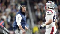 New England Patriots head coach Mike Vrabel talks with offensive tackle Will Campbell (66) during the third quarter against the Seattle Seahawks in Super Bowl LX at Levi's Stadium