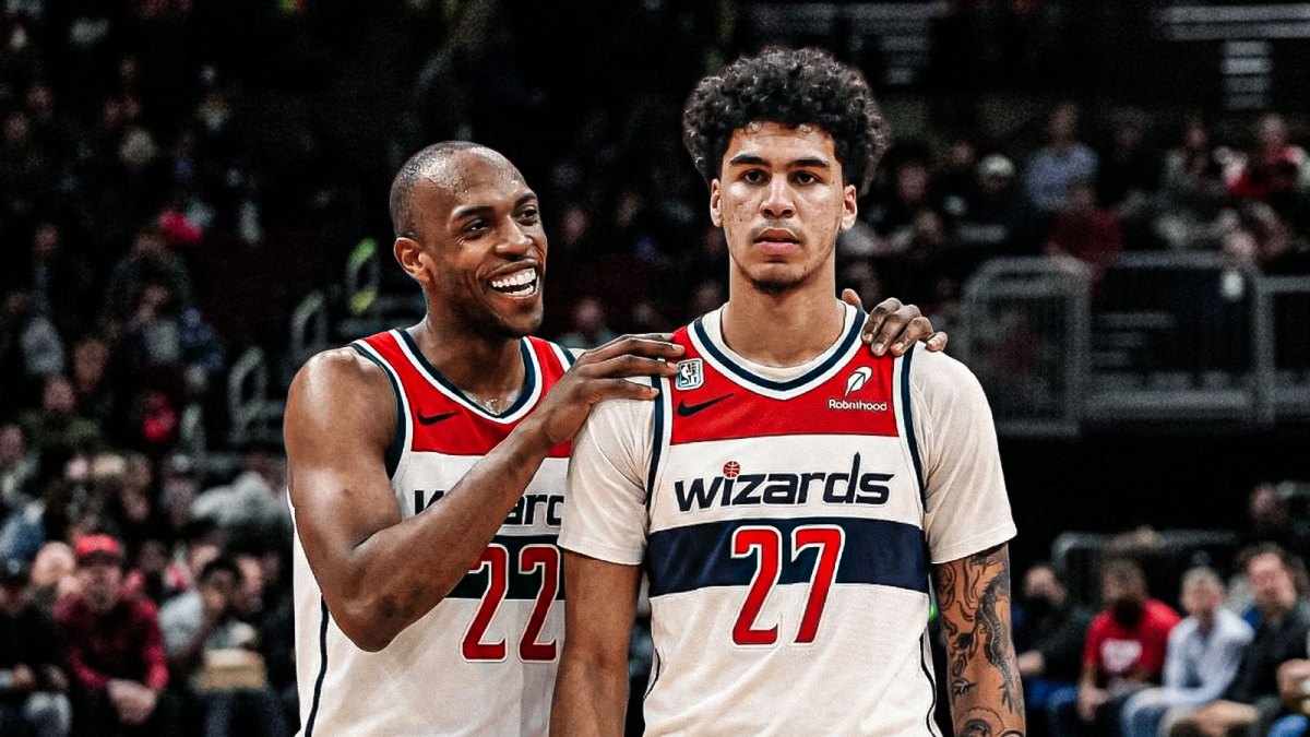 Khris Middleton smiles with his arm around Will Riley