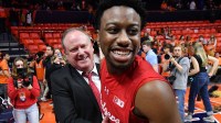 Wisconsin Badgers head coach Greg Gard gives a hand to player Wisconsin Badgers guard John Blackwell (25) after a win over the Illinois Fighting Illini during the second half at State Farm Center